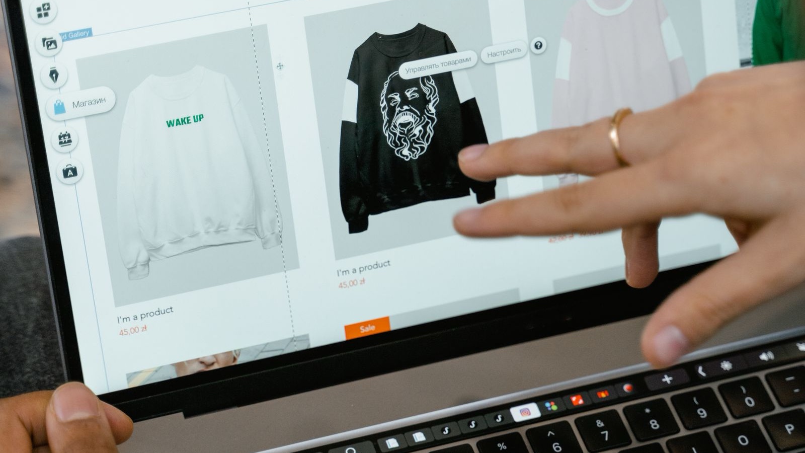Ecommerce Categories and Filters: Different Roles in Product Discovery Hand examining a store page with multiple products on a laptop