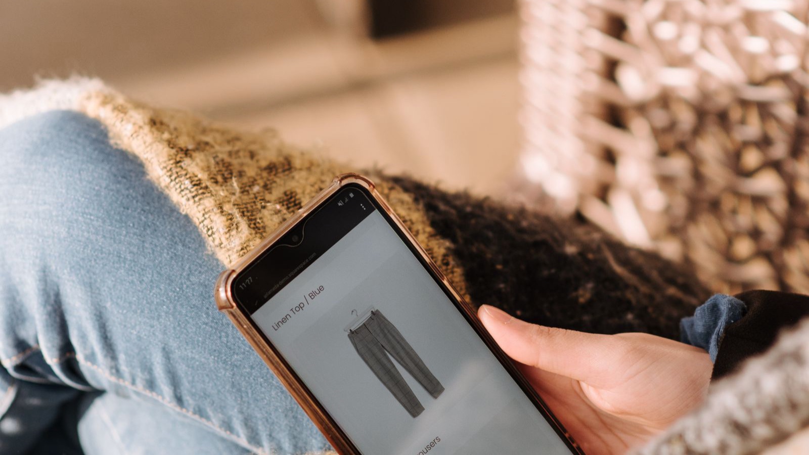 Ecommerce Site Search: What Happens When Nothing Matches? Close-up of a person browsing clothing products on a phone