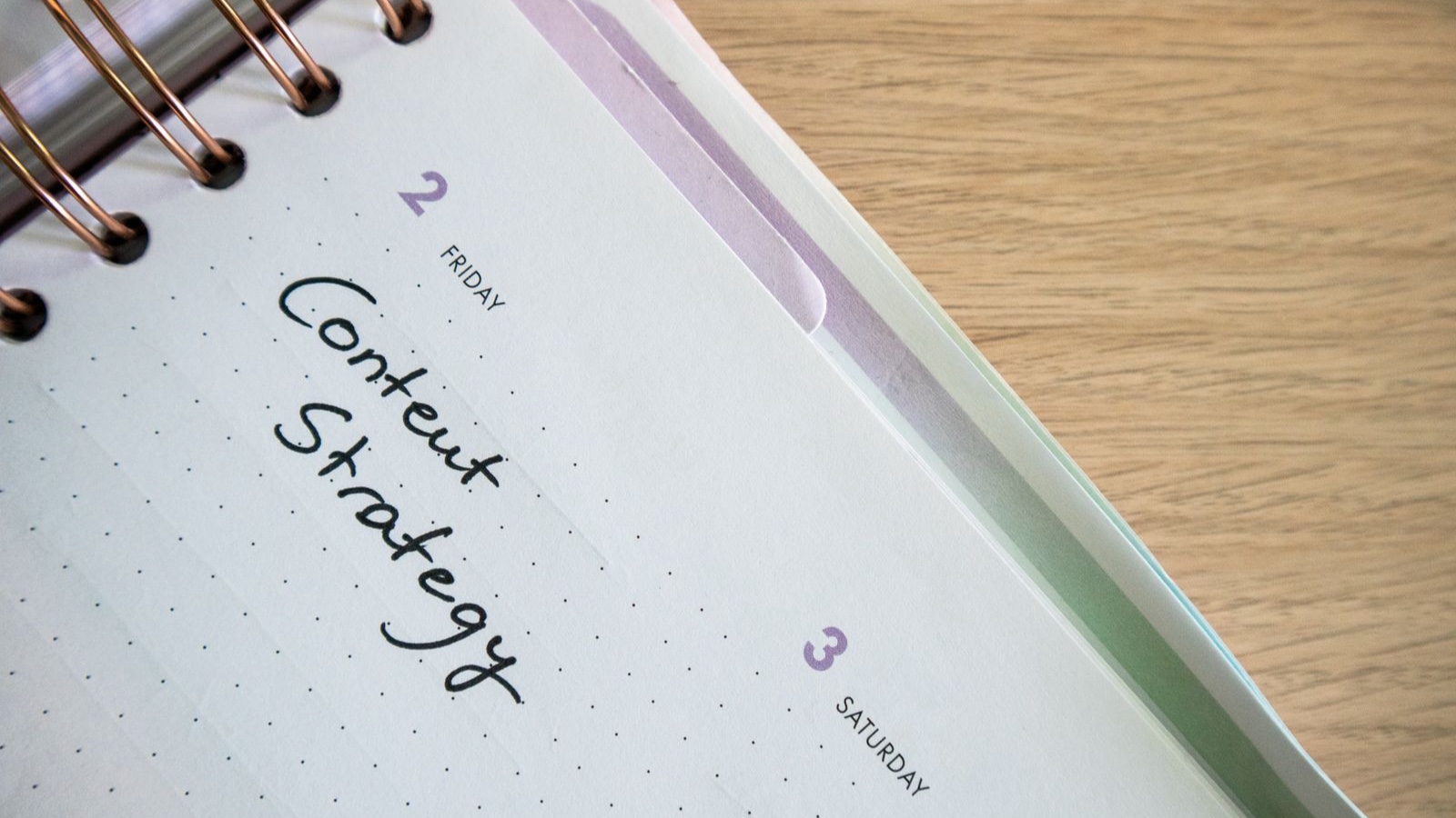 How to Build a Content Calendar Your Team Will Actually Use An open planner with handwritten content strategy notes