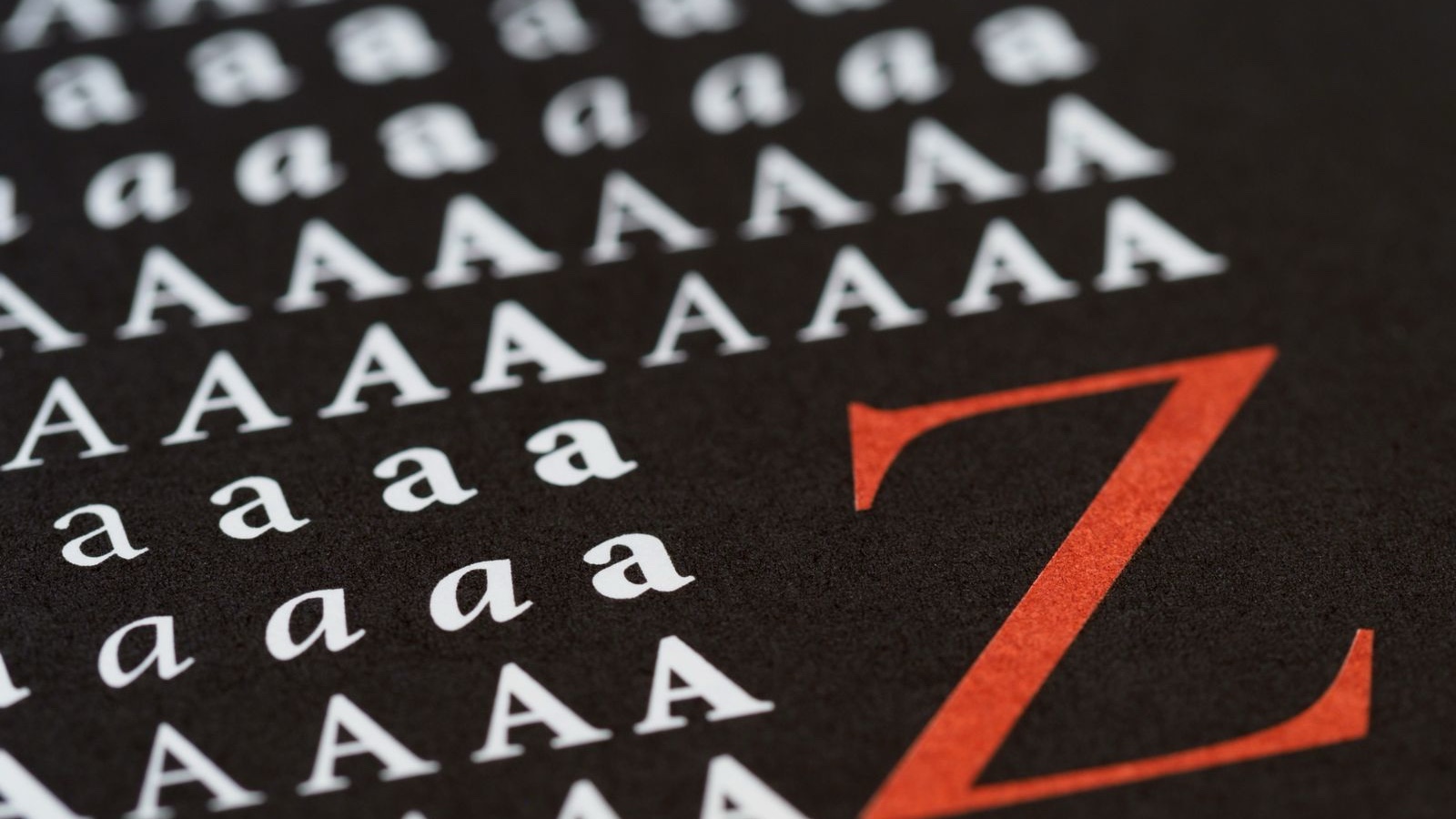 Letters in different sizes on a black background