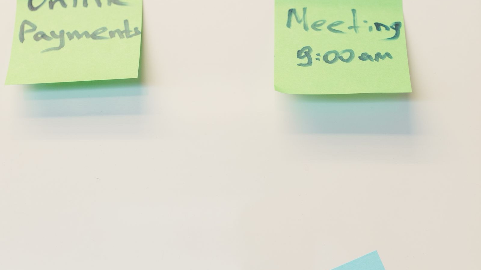 Sticky notes with strategy and meeting notes on a whiteboard