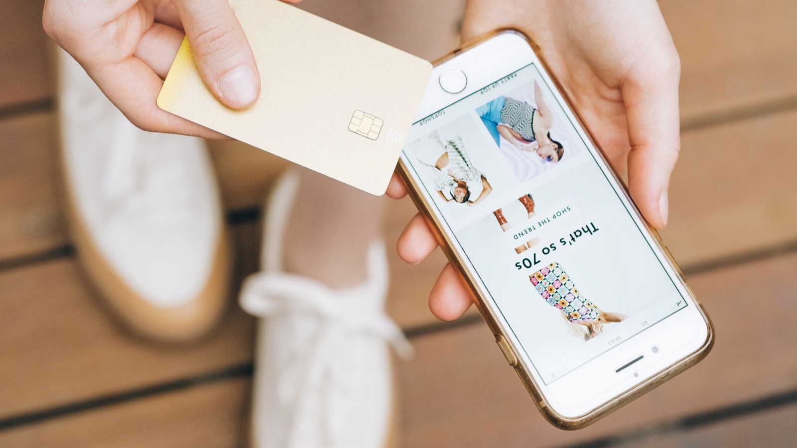 Mobile Ecommerce Experience: A Review from Basket to Payment Person holding a payment card while browsing products on a phone