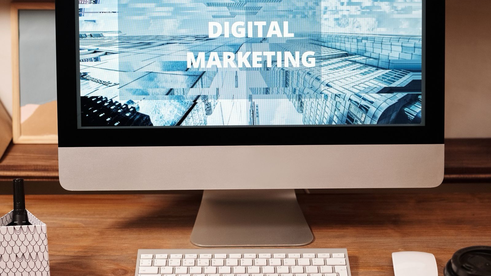 Organic Social Media and Advertising: Plan Resources Around the Work A desktop workspace with Digital Marketing displayed on a computer screen