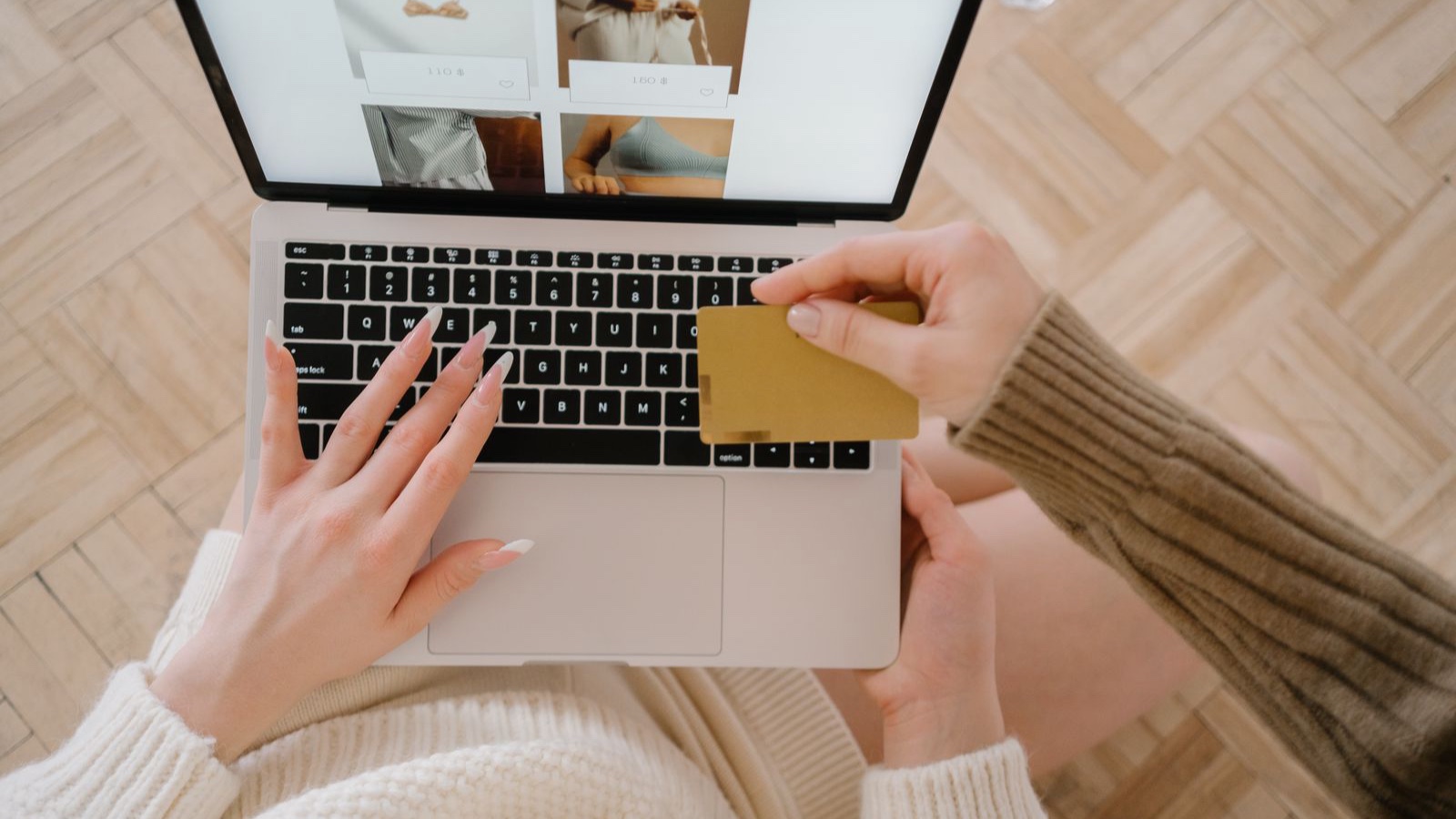 Cart Abandonment: Which Friction Should You Investigate First? Person shopping with a payment card on a laptop showing product listings