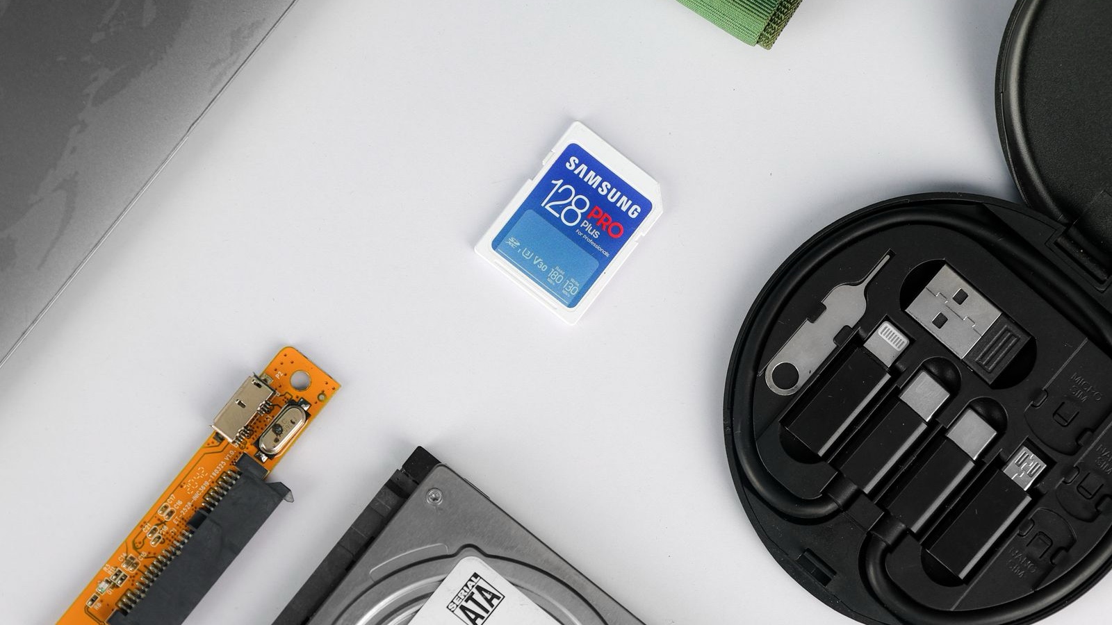 A memory card and data storage components on a white surface