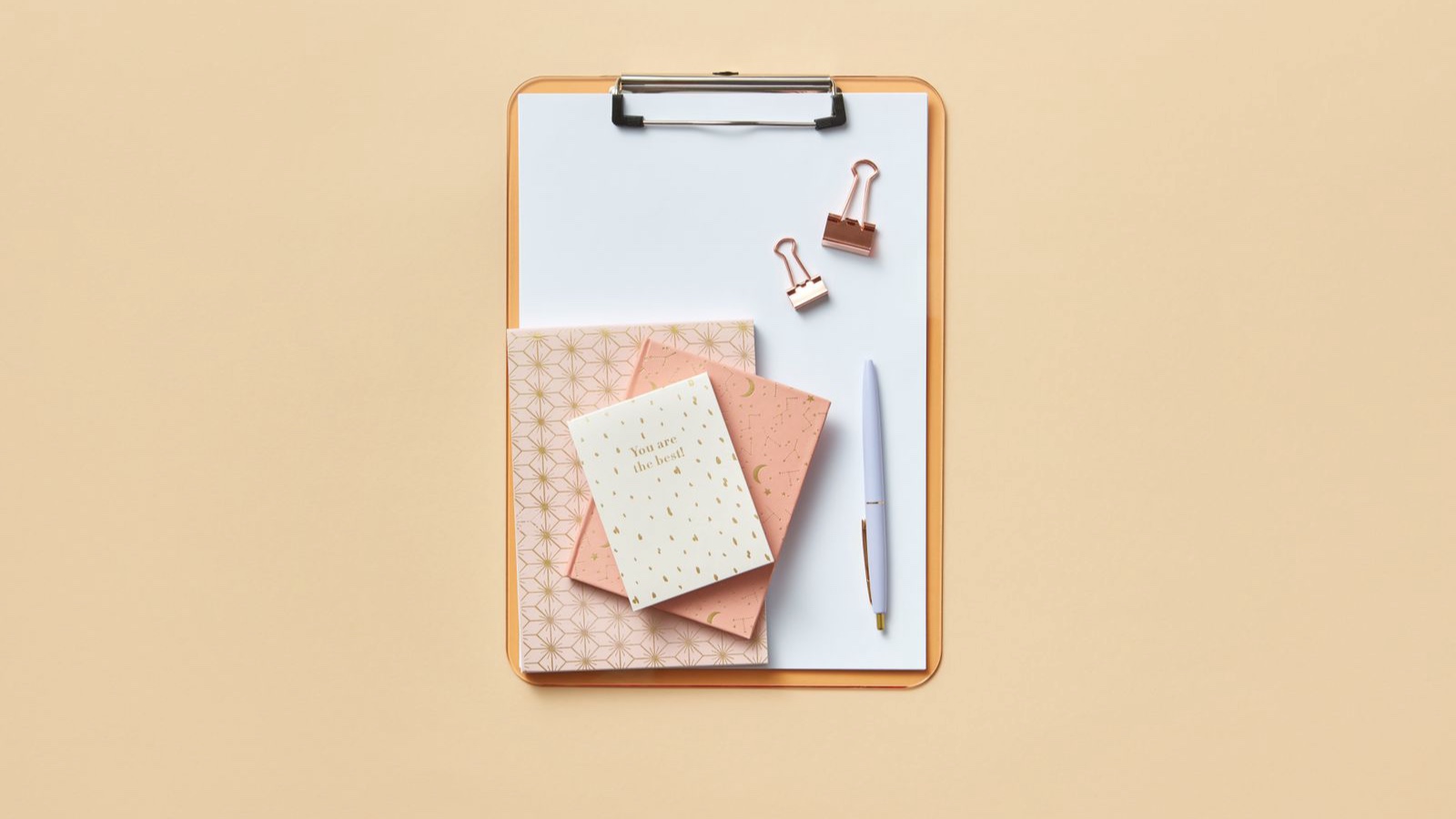 Social Media Copy: A Clear Headline, Useful Explanation and Relevant Next Step Notebooks and a pen on a clipboard ready for writing
