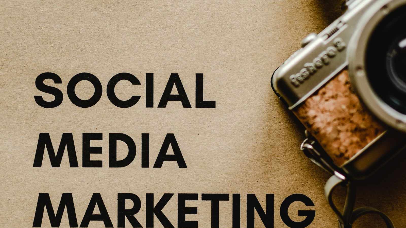 Social Media Management: From Publishing Schedule to Business Purpose A social media marketing note beside a digital camera