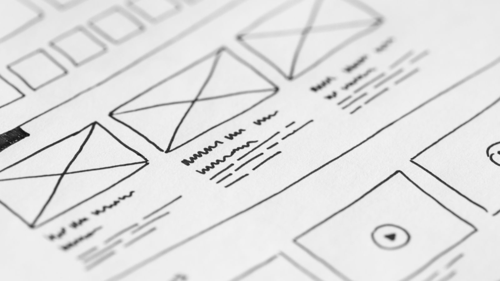 Website Proposal Briefs: Give the Agency a Clear Basis for Scope Detailed close-up of a hand-drawn wireframe design on paper for a UX project.