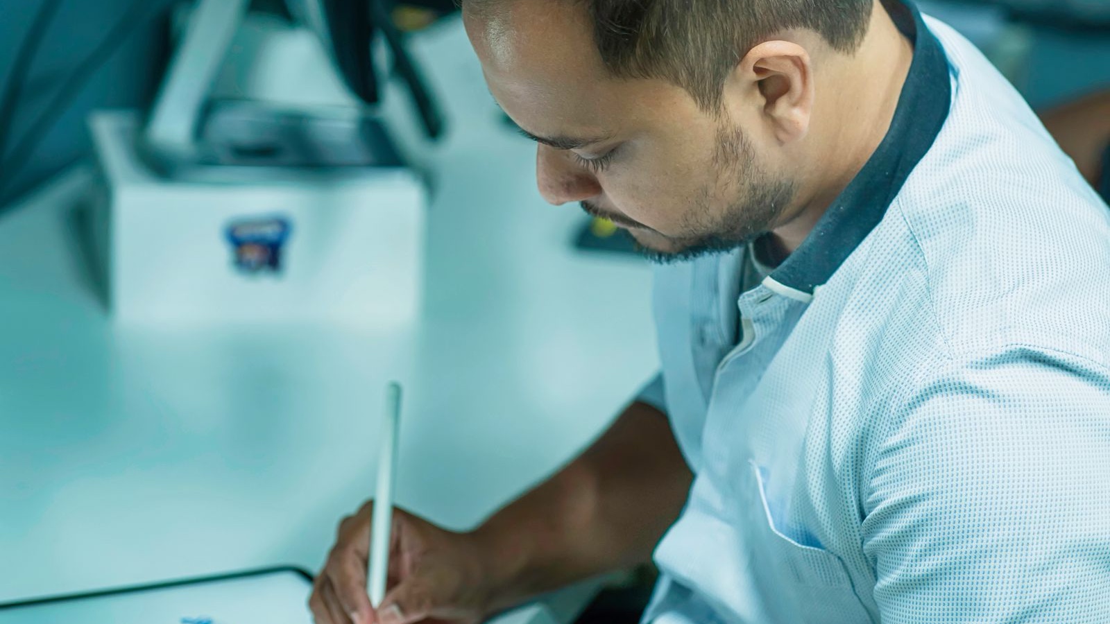 A designer drawing on a digital tablet